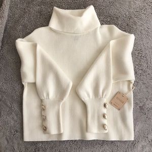 White sweater with pearl details